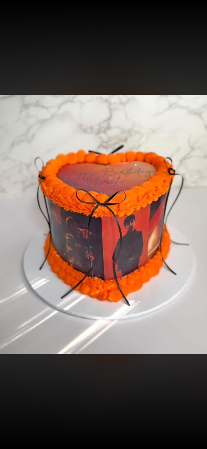 Orange heart shaped custom birthday cake