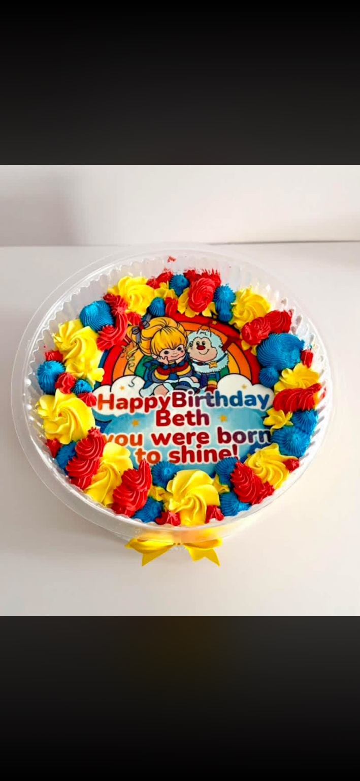 Colorful rainbow themed birthday cake